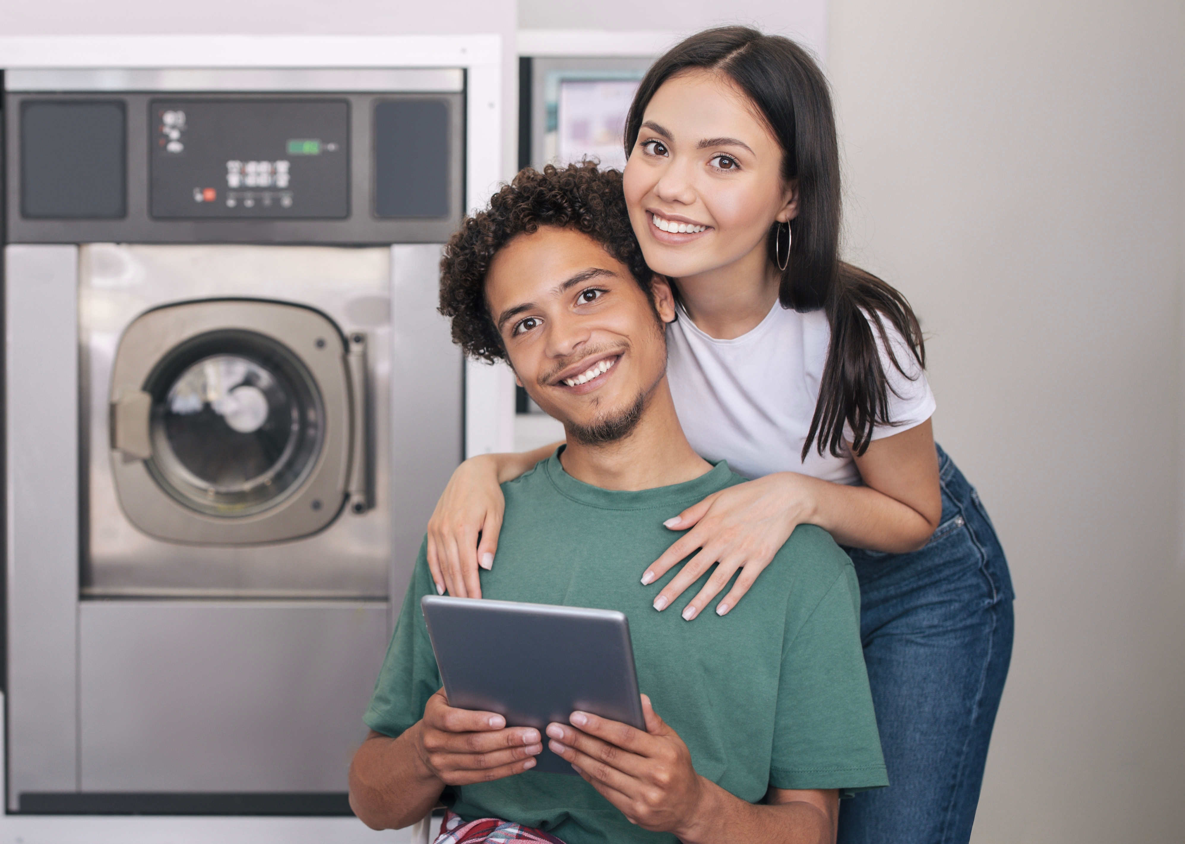 Happy Laundromat Copule Shutterstock 2313678297